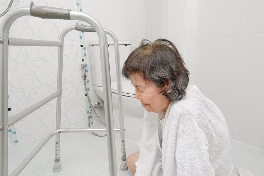 Elderly woman falling in bathroom because slippery surfaces Elderly woman falling in bathroom because slippery surfaces